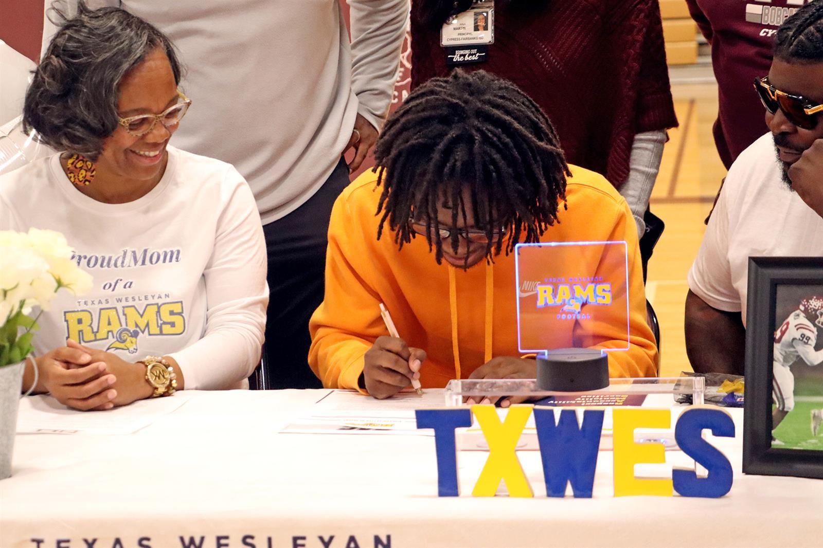 Cy-Fair High School senior Zaccheas Baynes signed his letter of intent to play football at Texas Wesleyan University.